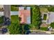 Birds eye view of the property and pool with lush trees and sidewalk lined streets at 1469 S Hillcrest Ave, Clearwater, FL 33756
