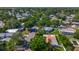 Aerial view showing the house nestled among lush greenery in a quiet neighborhood at 1469 S Hillcrest Ave, Clearwater, FL 33756
