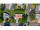 Aerial view of the house, with a tile roof, backyard, and a long driveway at 1469 S Hillcrest Ave, Clearwater, FL 33756