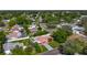 Aerial view of a home with a private yard, mature trees, and a long driveway at 1469 S Hillcrest Ave, Clearwater, FL 33756