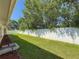 Well-maintained backyard featuring lush green grass and a white privacy fence, ideal for outdoor enjoyment at 1469 S Hillcrest Ave, Clearwater, FL 33756