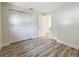 Bedroom with wood flooring and bi-fold closet doors at 1469 S Hillcrest Ave, Clearwater, FL 33756