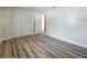 Bedroom featuring wood flooring and bi-fold closet at 1469 S Hillcrest Ave, Clearwater, FL 33756