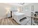 Cozy bedroom with soft carpet, ceiling fan, and bright windows at 1469 S Hillcrest Ave, Clearwater, FL 33756