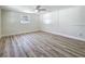 Spacious bedroom with sleek flooring, bright window, and ample natural light, offering a versatile layout at 1469 S Hillcrest Ave, Clearwater, FL 33756