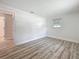 Bedroom showcasing wood flooring and window with blinds at 1469 S Hillcrest Ave, Clearwater, FL 33756