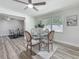 Cozy dining area featuring a glass table, four chairs and large window offering natural light at 1469 S Hillcrest Ave, Clearwater, FL 33756