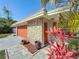 Charming single-Gathering home featuring stone accents, a two-car garage and well manicured landscaping at 1469 S Hillcrest Ave, Clearwater, FL 33756