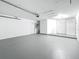 Spacious two-car garage with white walls and ample storage space, perfect for parking and projects at 1469 S Hillcrest Ave, Clearwater, FL 33756