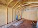 An unfinished interior view of the shed shows its wood frame structure and the building materials stored inside at 1469 S Hillcrest Ave, Clearwater, FL 33756