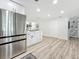 Bright kitchen with modern countertops and flooring with stainless steel appliances and center island at 1469 S Hillcrest Ave, Clearwater, FL 33756
