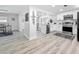 Modern kitchen with white cabinetry, stainless steel appliances, and hardwood flooring at 1469 S Hillcrest Ave, Clearwater, FL 33756