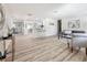 Open-concept living area boasts hardwood floors, modern furniture, and an airy ambiance at 1469 S Hillcrest Ave, Clearwater, FL 33756