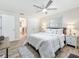 Comfortable main bedroom showcasing a plush bed, soft lighting, and en suite bathroom at 1469 S Hillcrest Ave, Clearwater, FL 33756