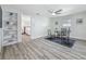 Bright office area with light walls, gray rug, ceiling fan and light wood floors at 1469 S Hillcrest Ave, Clearwater, FL 33756