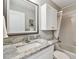 Functional bathroom with a single vanity, granite countertop, and a shower-tub combination, optimizing space and comfort at 1535 Nursery Rd # 111, Clearwater, FL 33756