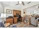 Office with built-in wooden desk with drawers, a ceiling fan, and backyard view at 1535 Nursery Rd # 111, Clearwater, FL 33756