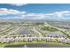 Wide aerial view of a well-planned community featuring interconnected lakes and neatly arranged homes at 16709 Barnwood Pl, Bradenton, FL 34211
