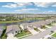 Beautiful aerial view showcases a home near a serene lake with fountain and well-kept neighborhood at 16709 Barnwood Pl, Bradenton, FL 34211