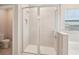 Bathroom with a walk-in shower and toilet at 16709 Barnwood Pl, Bradenton, FL 34211