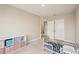 Bedroom with a small bed, closet, and a storage cube at 16709 Barnwood Pl, Bradenton, FL 34211