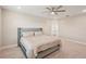 Spacious bedroom featuring a ceiling fan and plush carpeting at 16709 Barnwood Pl, Bradenton, FL 34211