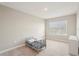 Bedroom with a small bed and natural light from a window at 16709 Barnwood Pl, Bradenton, FL 34211
