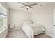 Bedroom with a ceiling fan and neutral decor at 16709 Barnwood Pl, Bradenton, FL 34211