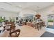 Bright cafe area featuring tile floors, light wood accents, and an inviting atmosphere, perfect for gatherings and relaxation at 16709 Barnwood Pl, Bradenton, FL 34211