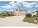 Charming two-story home with a three-car garage, manicured lawn, and beautiful landscaping at 16709 Barnwood Pl, Bradenton, FL 34211