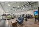 Spacious gym with high ceilings, exposed ductwork, and variety of fitness equipment at 16709 Barnwood Pl, Bradenton, FL 34211