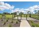 Gated pet park features lush green grass, benches, and a water station for your furry friends to enjoy at 16709 Barnwood Pl, Bradenton, FL 34211