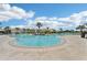 Expansive pool area featuring lounge chairs, shaded cabanas, and a picturesque setting for relaxation and recreation at 16709 Barnwood Pl, Bradenton, FL 34211