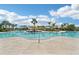 Resort-style pool showcasing clear blue water, tropical landscaping, and comfortable lounge areas for ultimate relaxation at 16709 Barnwood Pl, Bradenton, FL 34211