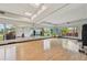 Bright and airy exercise studio with hardwood floors, large mirrors, and floor to ceiling windows at 16709 Barnwood Pl, Bradenton, FL 34211