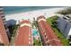 An aerial view of the condo complex showing a swimming pool and proximity to the beach at 17960 Gulf Blvd # 104, Redington Shores, FL 33708