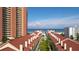 Stunning aerial view of rooftops with beach and ocean scenery, creating an idyllic coastal ambiance at 17960 Gulf Blvd # 104, Redington Shores, FL 33708