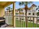 Private balcony with seating and views of the landscaped grounds and other condos at 17960 Gulf Blvd # 104, Redington Shores, FL 33708