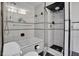 Bathroom features white and black tile, a shower, and a bathtub at 17960 Gulf Blvd # 104, Redington Shores, FL 33708