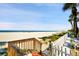 Stunning beach view featuring sugar-white sand, clear blue water and palm trees at 17960 Gulf Blvd # 104, Redington Shores, FL 33708