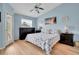 Comfortable bedroom features a ceiling fan, window, and a door to the outside at 17960 Gulf Blvd # 104, Redington Shores, FL 33708