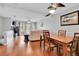 Open-plan living and dining area with hardwood floors, fireplace, and plenty of natural light at 17960 Gulf Blvd # 104, Redington Shores, FL 33708