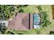 Aerial view of the home showcasing the backyard pool and lush landscaping at 19139 Cypress Reach Ln, Tampa, FL 33647