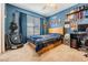 Bedroom painted in light blue, window with lots of light, decorated walls and ceiling fan at 19139 Cypress Reach Ln, Tampa, FL 33647