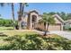 Two-story home with a well-maintained front lawn and a two-car garage at 19139 Cypress Reach Ln, Tampa, FL 33647