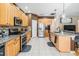 Bright kitchen featuring granite countertops, stainless steel appliances, and a spacious island at 19139 Cypress Reach Ln, Tampa, FL 33647