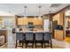 Gourmet kitchen featuring an island with counter seating, granite countertops, and stainless steel appliances at 19139 Cypress Reach Ln, Tampa, FL 33647