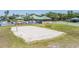 A beach volleyball court and covered picnic area in the community at 19139 Cypress Reach Ln, Tampa, FL 33647
