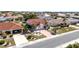 Aerial view of home featuring attached two car garage, luscious landscaping and beautiful lawn at 1969 Wolf Laurel Dr, Sun City Center, FL 33573