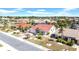 This beautiful home features a red tile roof, mature landscaping and an attached two car garage at 1969 Wolf Laurel Dr, Sun City Center, FL 33573